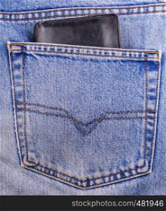 old black Wallet showing in back pocket of jeans