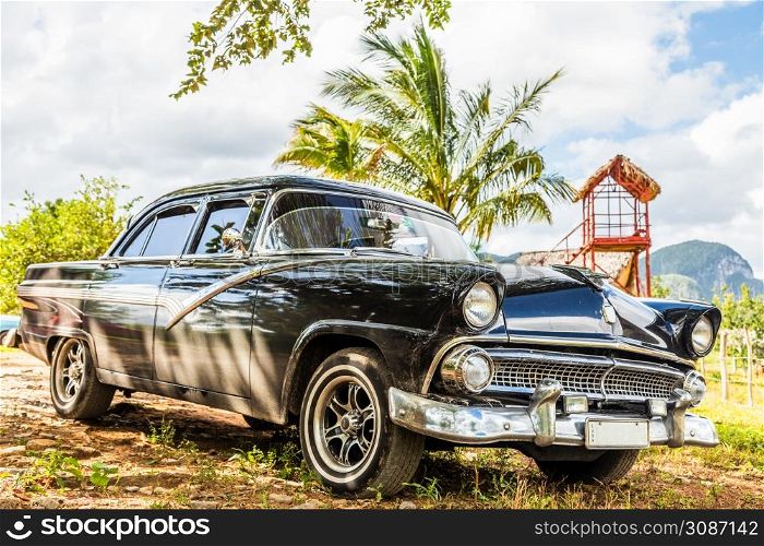 Old blcak american retro car parked in Vinales, Cuba