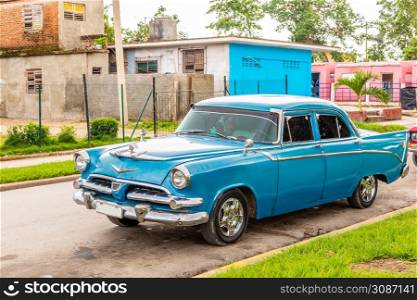 Old blue american retro car on the street of Camaguay, Cuba