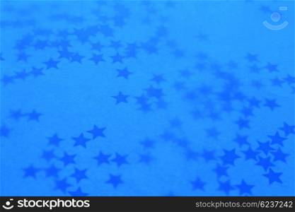 Old blue holiday wallpaper with a stars