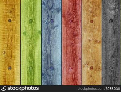 Old boards painted in different colors. Background old panel with rusty nails