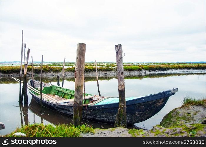 Old boats in water canal of Rio Aveiro, Portugal