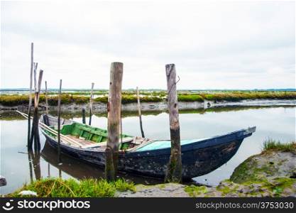 Old boats in water canal of Rio Aveiro, Portugal