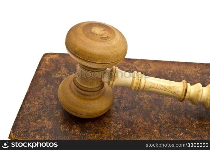 Old book and gavel isolated on white background