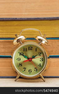 old books and alarm clock