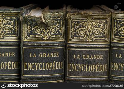 Old books on shelf. French encyclopedia. Close up shot