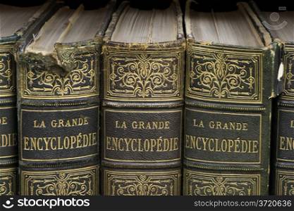 Old books on shelf. French encyclopedia. Close up shot