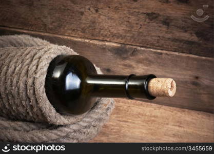 Old bottle of wine on the board