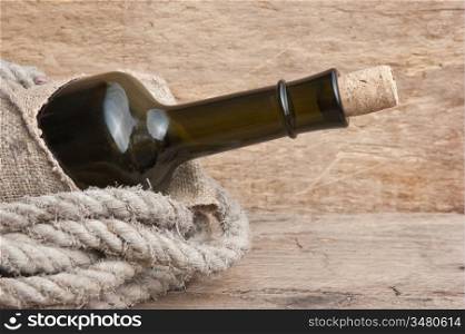 Old bottle of wine on the board