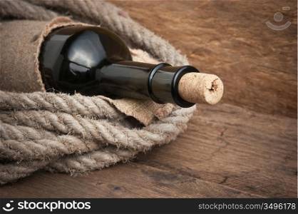 Old bottle of wine on the board