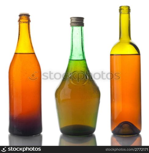 Old bottles with some crust isolated on white