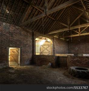Old brick and timber constructed hay barn, Worcestershire, England.