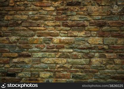 Old brick or stone wall texture grunge brown background