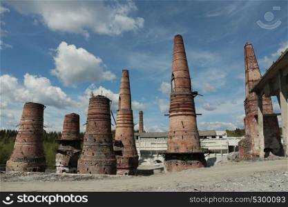 Old brick pipes of abandoned marble factory in Ruskeala, Karelia republic, Russia