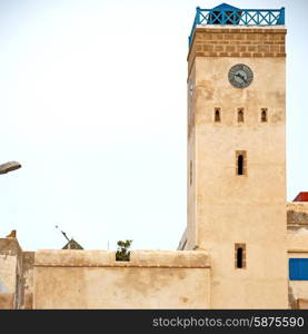 old brick tower in morocco africa village and the sky