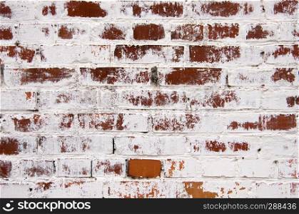 old brick wall texture background with worn off paint