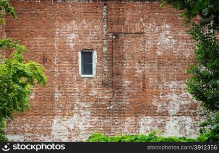 Old Brick Wall with White Window