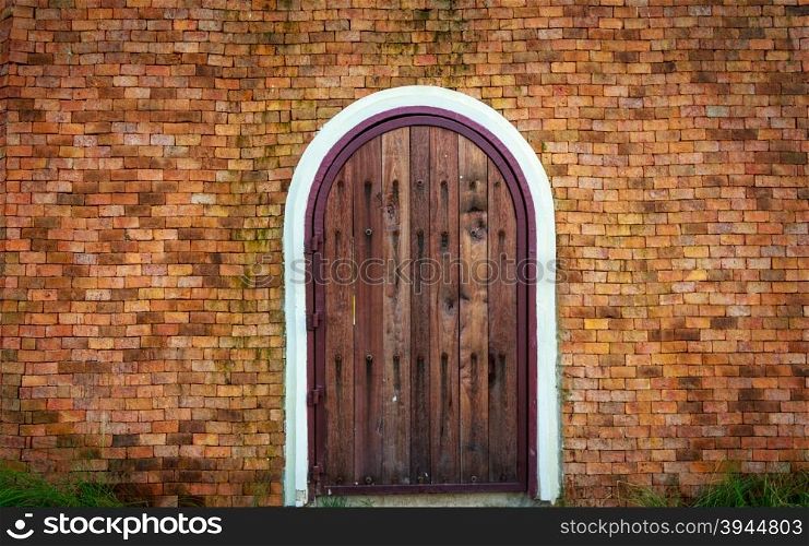 Old Brick Wall With Wooden Doorway