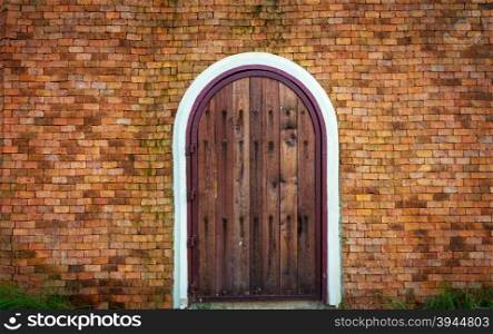 Old Brick Wall With Wooden Doorway
