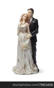 Old bride and groom cake topper on white background