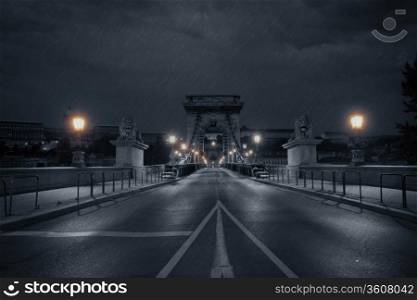 Old bridge at rainy night. Budapest, Hungary