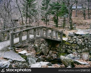 Old bridge under a creek in the forest of Seoraksan National Park. South Korea