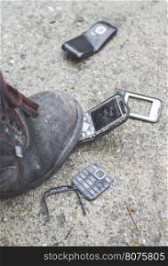 Old broken mobile phone. Boot crease phone