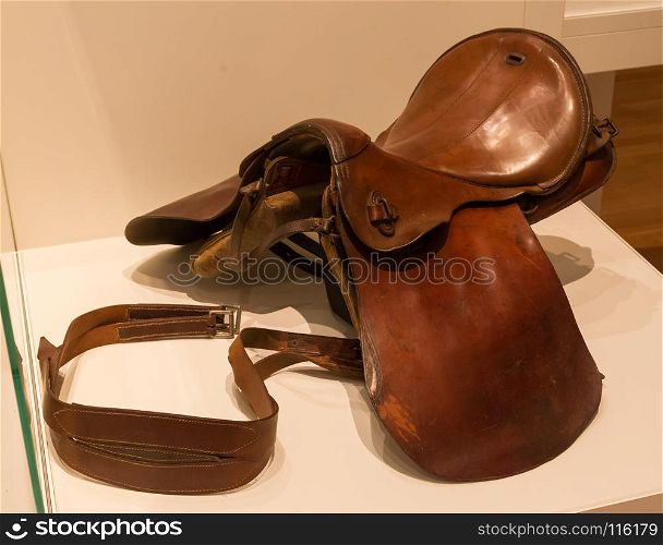 Old brown leather saddle, not in use anymore