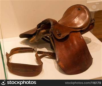 Old brown leather saddle, not in use anymore