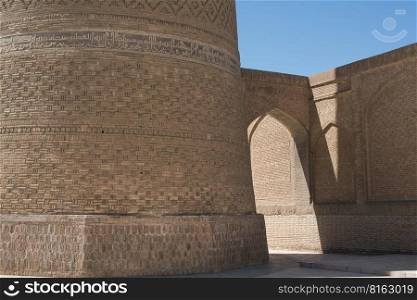 Old building with arch and passage. The ancient buildings of medieval Asia. Bukhara, Uzbekistan. Ancient architecture of Central Asia and East