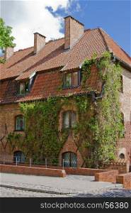 Old building with ivy on the wall in the lower castle in Malbork. Poland