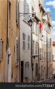 Old buildings on a steep street in the Old Port area of Marseille, France