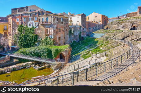 Old buildings on ancient ruins of roman theater in Catania, Sicily, Italy