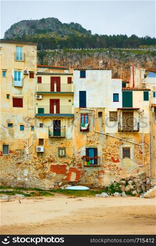 Old buildings on the beach in The Old Town of Cefalu, Sicily, Italy