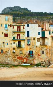 Old buildings on the beach in The Old Town of Cefalu, Sicily, Italy