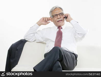 Old businessman taking on the phone