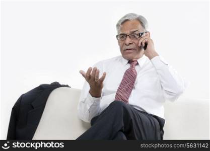 Old businessman taking on the phone