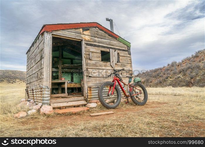old cabin in Rocky Mountains and a fat bike - Red Mountain Open Space near Fort Collins, Colorado