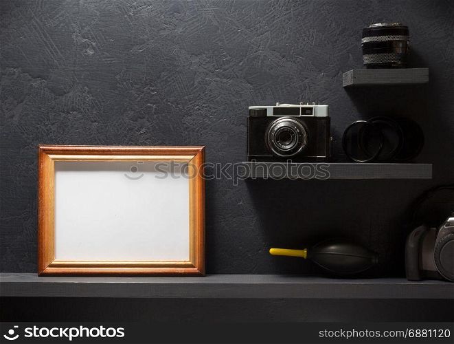 old camera at shelf wall wooden background texture