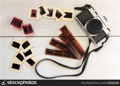 old camera with negatives and slides photography