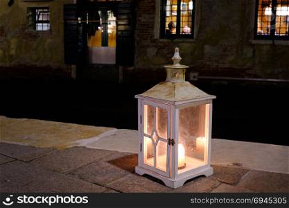 Old candle lantern at the night european city, Venice, Italy