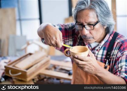 old carpenter man working from home, wood worker concept
