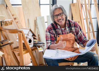 old carpenter man working from home, wood worker concept