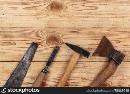 Old carpentry tools on a wooden background. carpentry tools on a wooden background