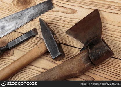 Old carpentry tools on a wooden background. carpentry tools on a wooden background