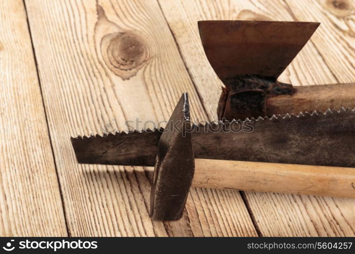 Old carpentry tools on a wooden background. carpentry tools on a wooden background