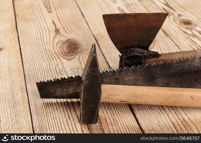 Old carpentry tools on a wooden background. carpentry tools on a wooden background