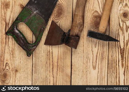 Old carpentry tools on a wooden background. carpentry tools on a wooden background