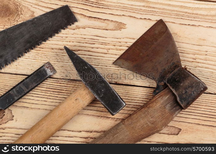 Old carpentry tools on a wooden background. carpentry tools on a wooden background