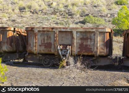 old cars in a coal mine dump with automatic system